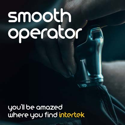 Hand on top of automobile gear shift